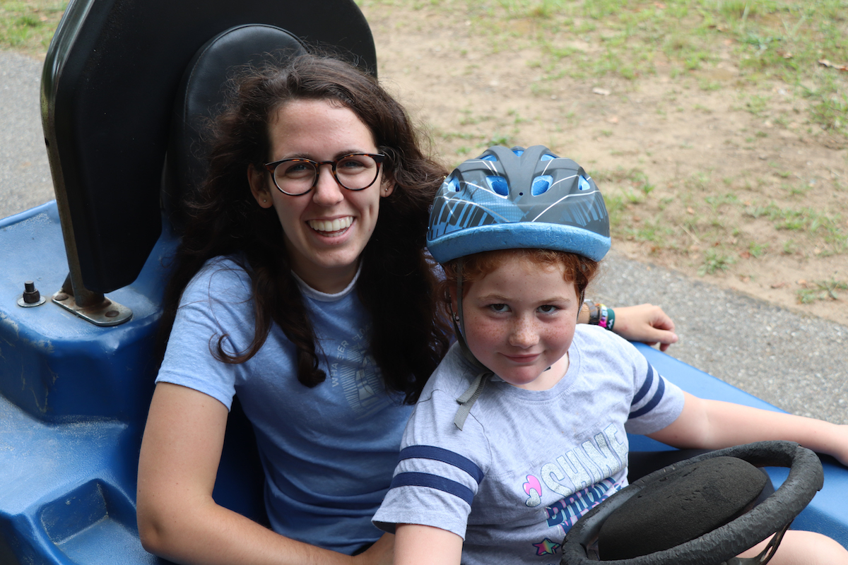 Child driving a go kart at Pine Ridge Camp